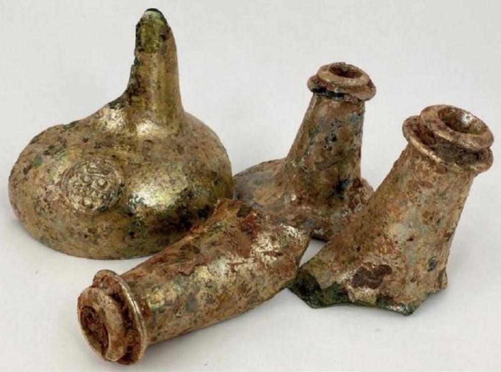 This group of four neck fragments, including one with a seal, found with wine bottles.