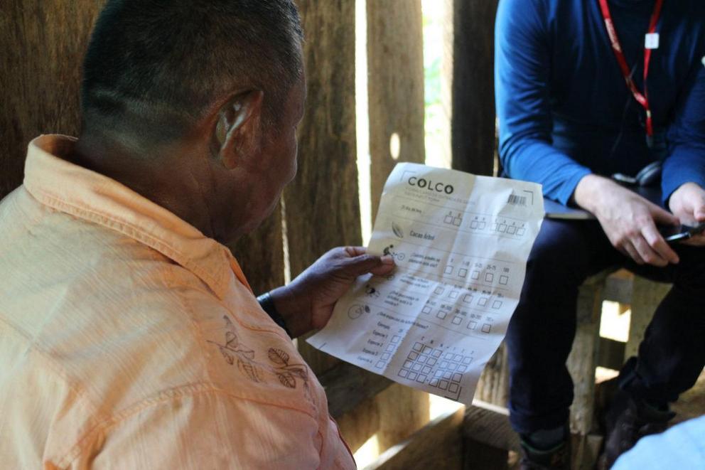 A cacao farmer being interviewed for COLCO at his home in Santander, Colombia. The machine-readable concept sheet was designed as a prompt to gather farm data from all kinds of users, both literate and illiterate.