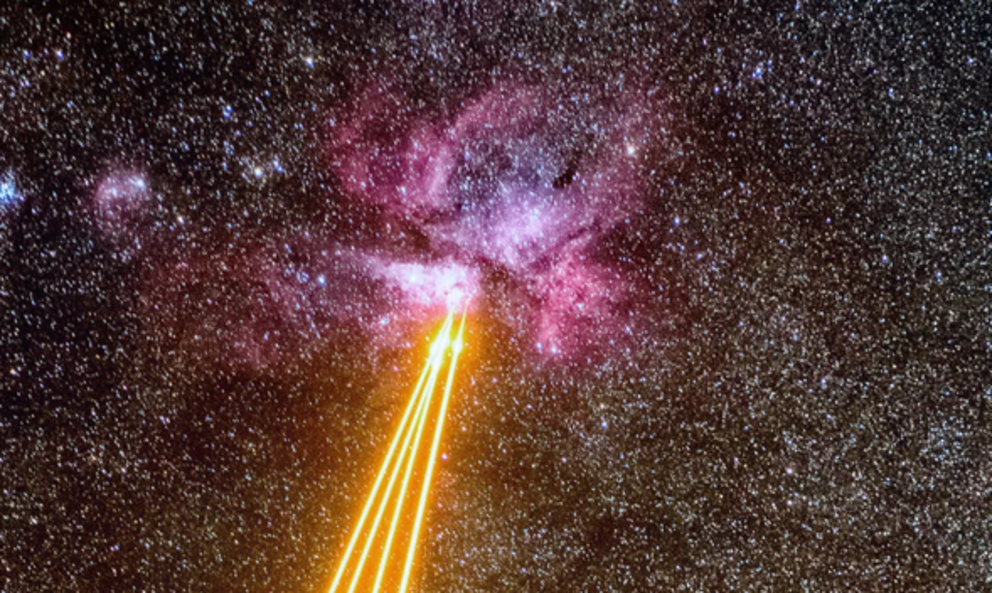 Lasers fly through space toward the glowing Carina Nebula (Image: © ESO/G. Hüdepohl)