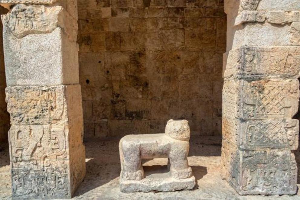 Eroded glyphs cover the surfaces of the Jaguar Temple at Chichen Itza.