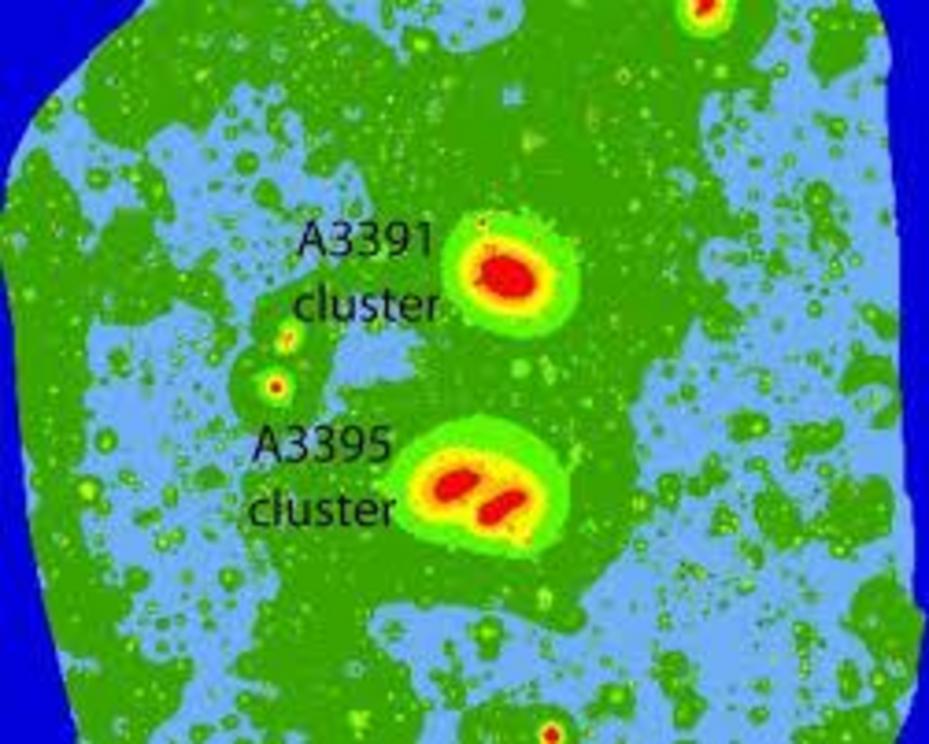 eROSITA image showing the clusters at the centre, and the dark green gaseous filament stretching 50 million light-years from the bottom left to the top right.