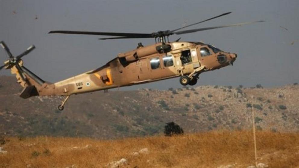 An Israeli army helicopter arrives at the site of an accidental grenade explosion near the village of Majdal Shams in the Israeli-occupied Golan Heights on July 17, 2016. (Photo by AFP)