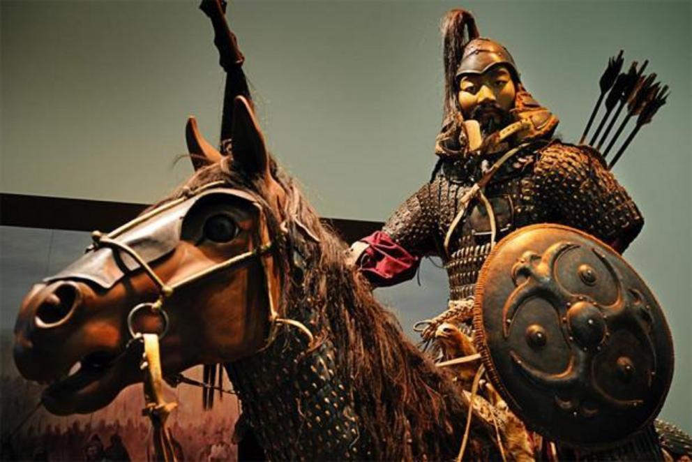 Statue of Genghis Khan, the emperor that ordered many genocides, on horseback in battle.