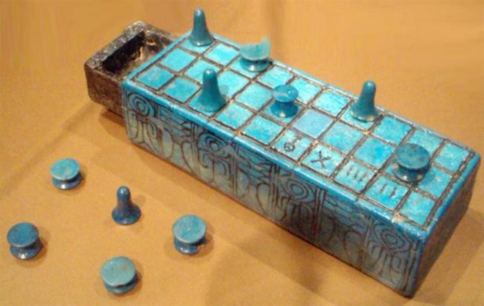 Faience senet board and playing pieces inscribed with the name of Amunhotep III. Reportedly from Thebes, and possibly from his tomb.