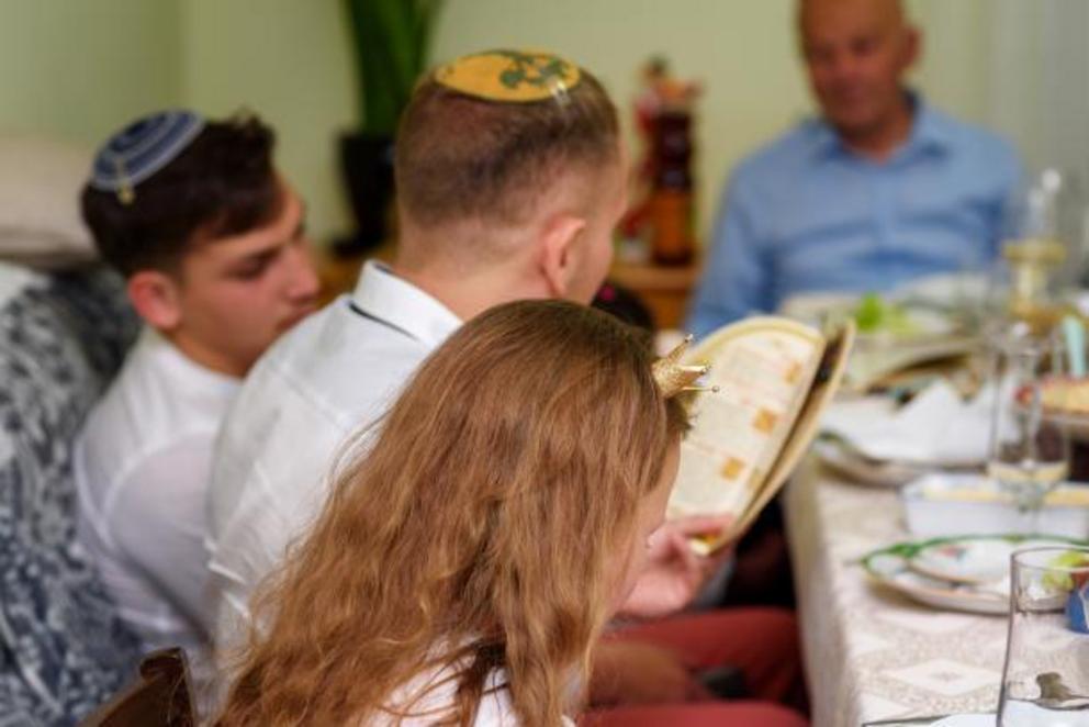 A Jewish family celebrating passover.