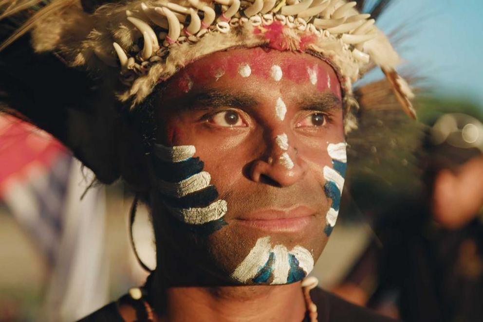 Ronny Kareni wears the colours of the Morning Star flag, the symbol of West Papua's independence movement.(Foreign Correspondent: Greg Nelson ACS)