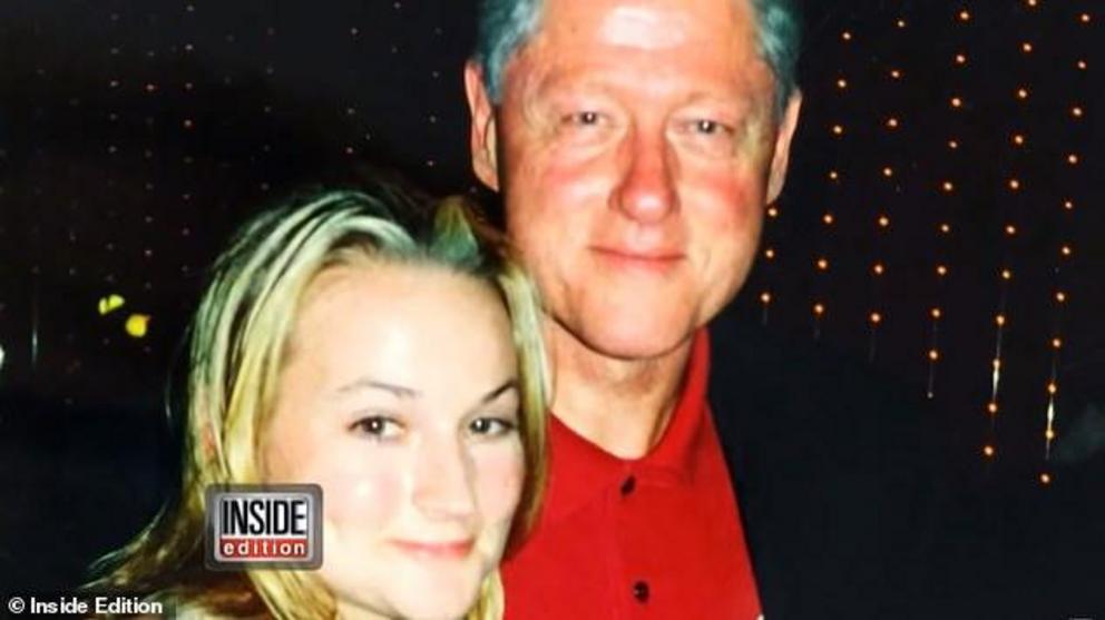 Photos emerged (above) in January of Clinton with his arm round Chauntae Davies, who has told how she was recruited to be Epstein's personal masseuse and sex slave