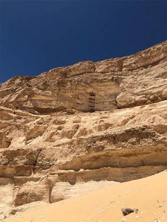 The openings discovered high up in a cliff face are “entrances to carved out chambers, which probably have sacred religious importance.”