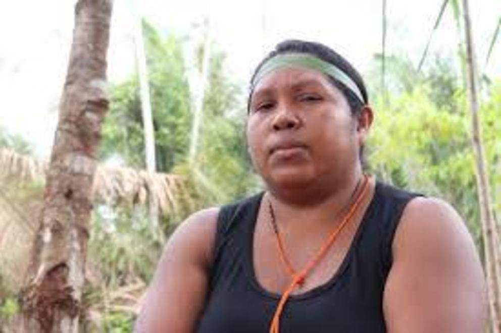 Women warrior Rosilene Guajajara sits in her home village.