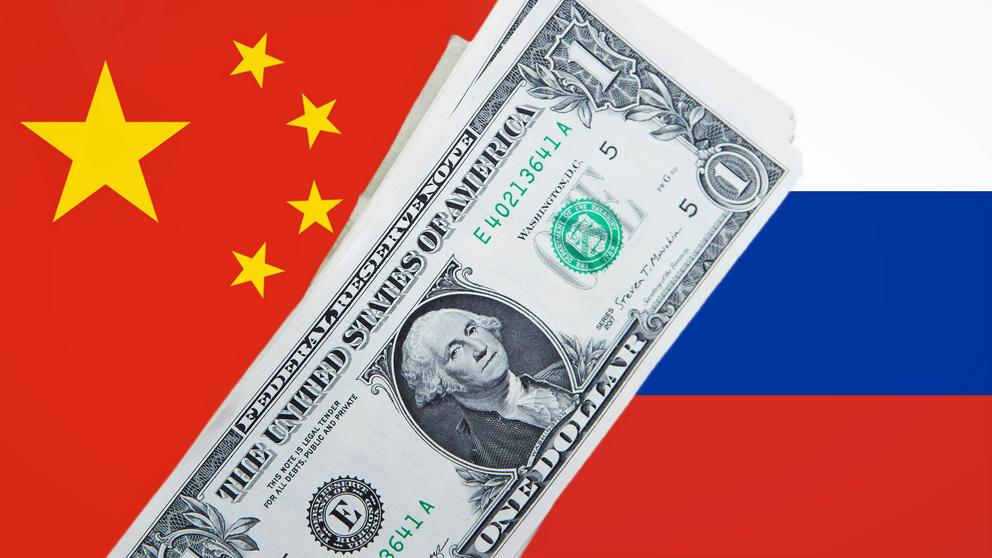 China and Russia have roughly halved their use of the dollar in trade settlements over the past five years. (Source photo by AP) 