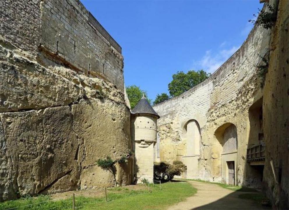 A passageway between the outer walls and the inner structures of Château de Brézé.