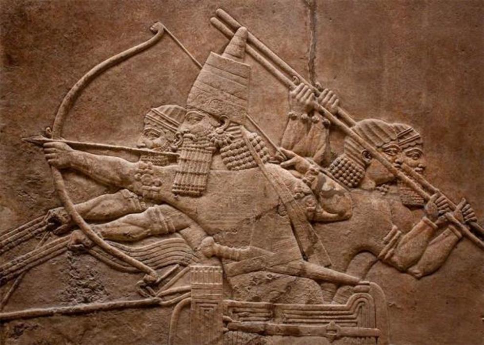 Ancient relief of Assyrian warriors fighting in the war