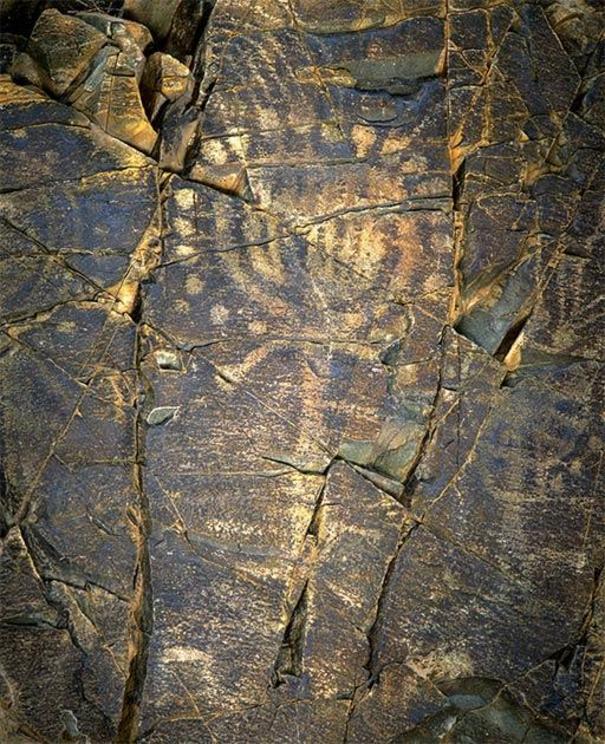 Image of a man with a sun-shaped head, petroglyph of Tamgaly