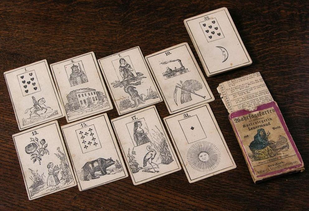 This Lenormand-style oracle deck shows a mixture of playing card and fortune-telling illustrations, circa 1870.