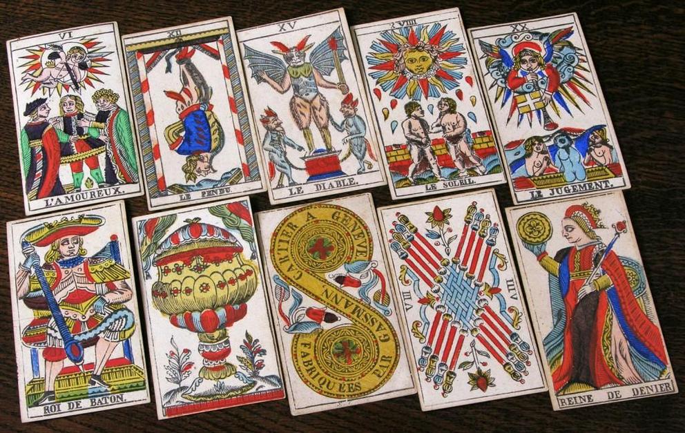 Top: A selection of trump cards (top row) and pip cards (bottom row) from the first edition of the Rider-Waite deck, circa 1909. Via the World of Playing Cards. Above: Cards from a Tarot de Marseille deck made by François Gassmann, circa 1870.