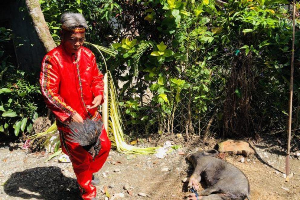 Manobo tribesman prepares for a ritual to ask the permission of their deity for the researchers to conduct the study in the forest.