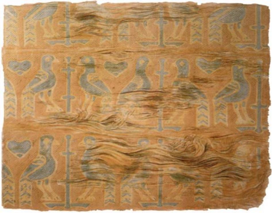 The motive on this Viking burial textile, a pillow, found in one of the reliquaries in Denmark shows birds, probably peacocks, flanking a stylized tree or cross. It consists of several silk pieces sewn together.