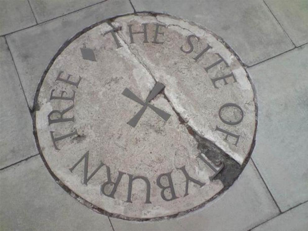 The stone commemorating the Tyburn Tree site on the traffic island at the junction of Edgware Road and Marble Arch.