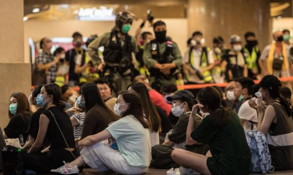 Riot police detain people after they cleared protesters taking part in a rally against a new national security law in Hong Kong on July 1, 2020. ( Dale De La Rey/AFP via Getty Images)