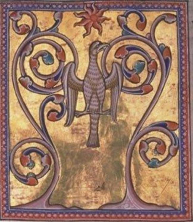 A reborn Phoenix. A ventral view of the bird between two trees, with wings out stretched and head to one side, possibly collecting twigs for its pyre but also associated with Jesus on the cross
