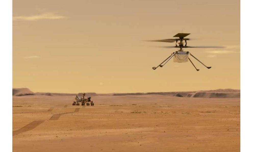 This illustration made available by NASA depicts the Ingenuity helicopter on Mars after launching from the Perseverance rover, background left. It will be the first aircraft to attempt controlled flight on another planet.