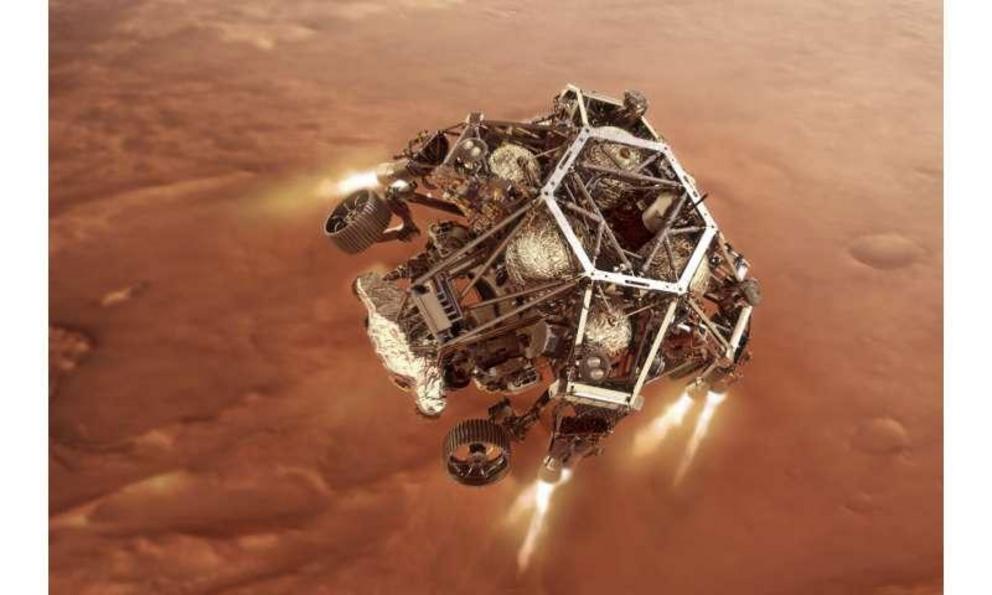 In this illustration provided by NASA, the Perseverance rover fires up its descent stage engines as it nears the Martian surface.. This phase of its entry, descent and landing sequence, or EDL, is known as 