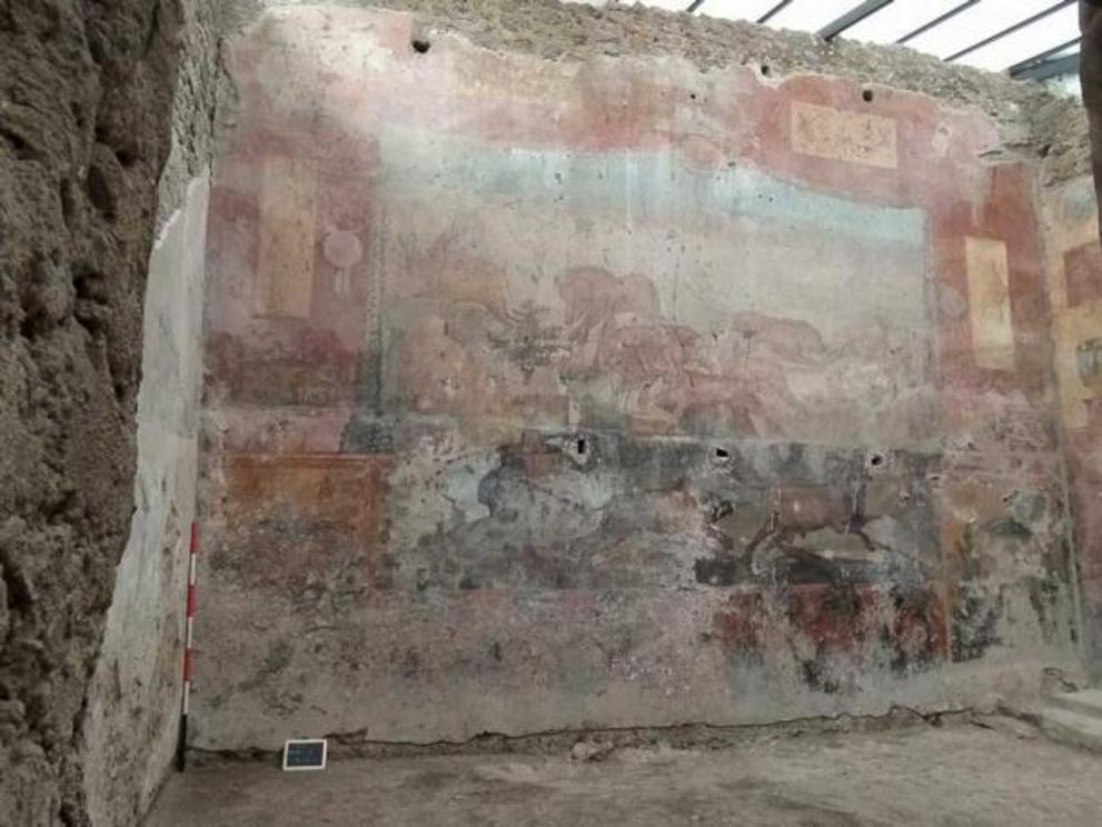 The faded fresco before it underwent restoration.