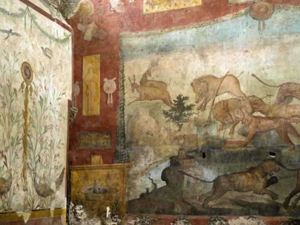 Vibrant hunting scene on the restored fresco.