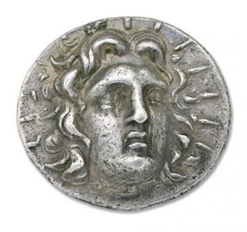 Silver tetradrachm from about 205 to 190 BC featuring the Sun god Helios, the chief god of Rhodes. About 205-190 BCE.