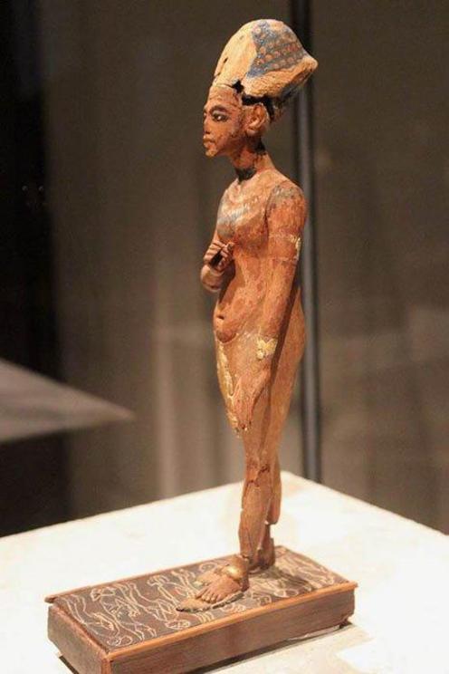 Wooden standing statue of Akhenaten, currently in the Egyptian Museum of Berlin, that also shows how his body was different or depicted differently.