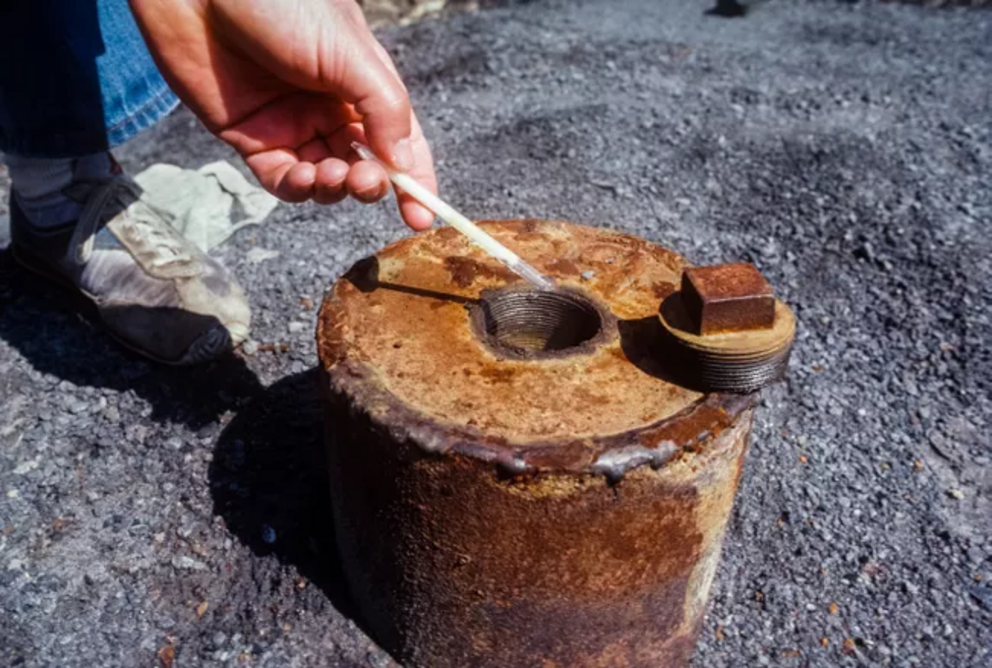 View of a sulfur dioxide detection tube held over a capped borehole in Centralia, Pennsylvania, in June, 1981.