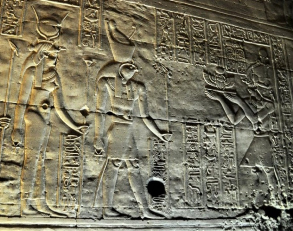 Figure 8: Horus and Hathor receiving a scarab offering from the Pharaoh. Temple of Horus at Edfu, Egypt.