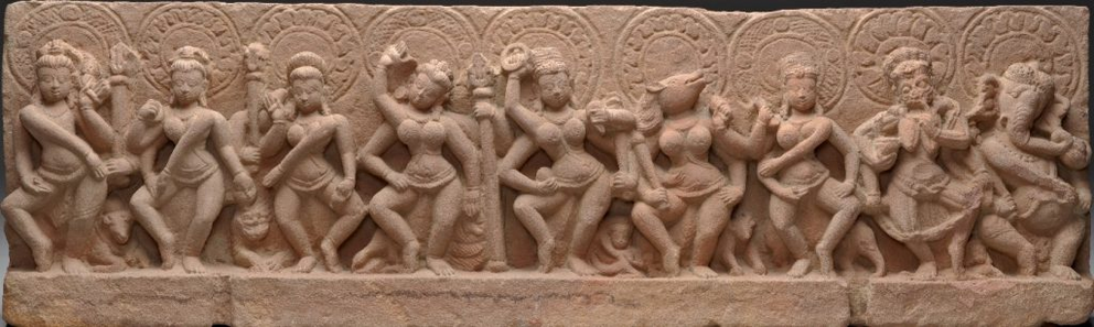 Figure 15: The Sapta Matrikas (Seven Mothers) depicted as dancers and warriors. They are flanked by Shiva and Ganesha. Madhya Pradesh, 9th century.