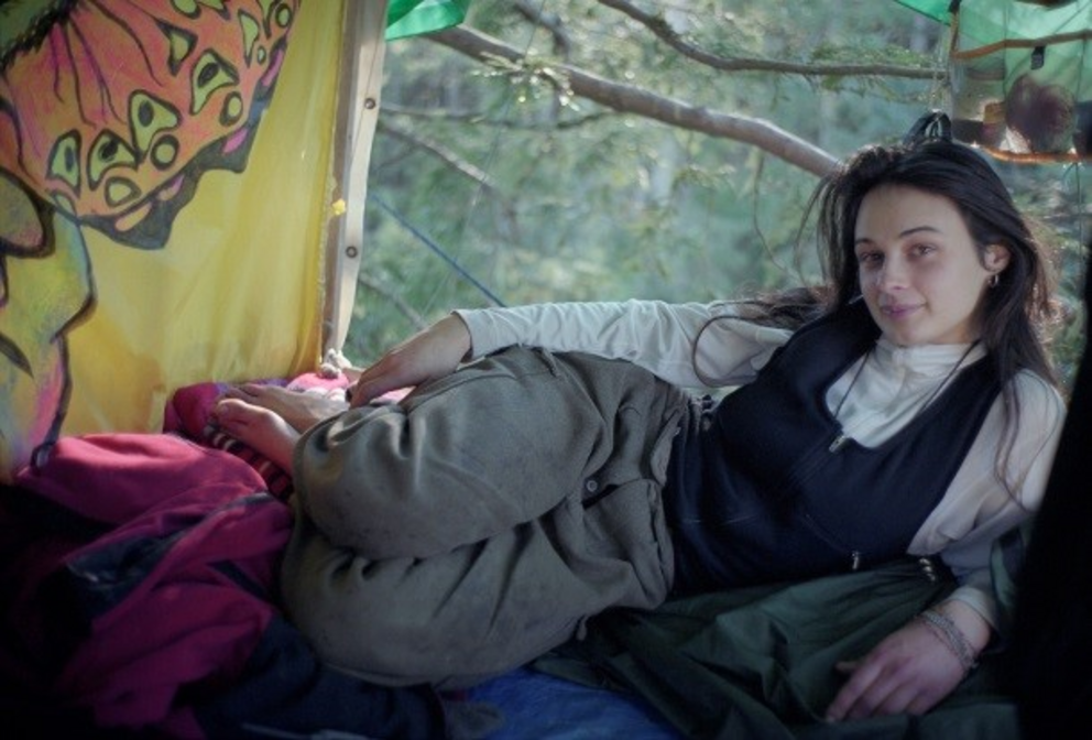 “Julia ‘Butterfly’ Hill poses in her tree-top shelter nearly 200 feet above the ground in December 1998, one year into her standoff with the Pacific Lumber Company in Humboldt County, California.