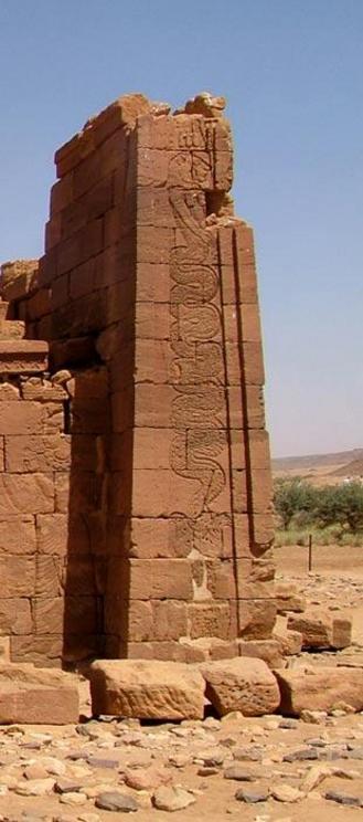 Temple exterior showing Apedemak as a snake coming out of a lotus with a lion head.