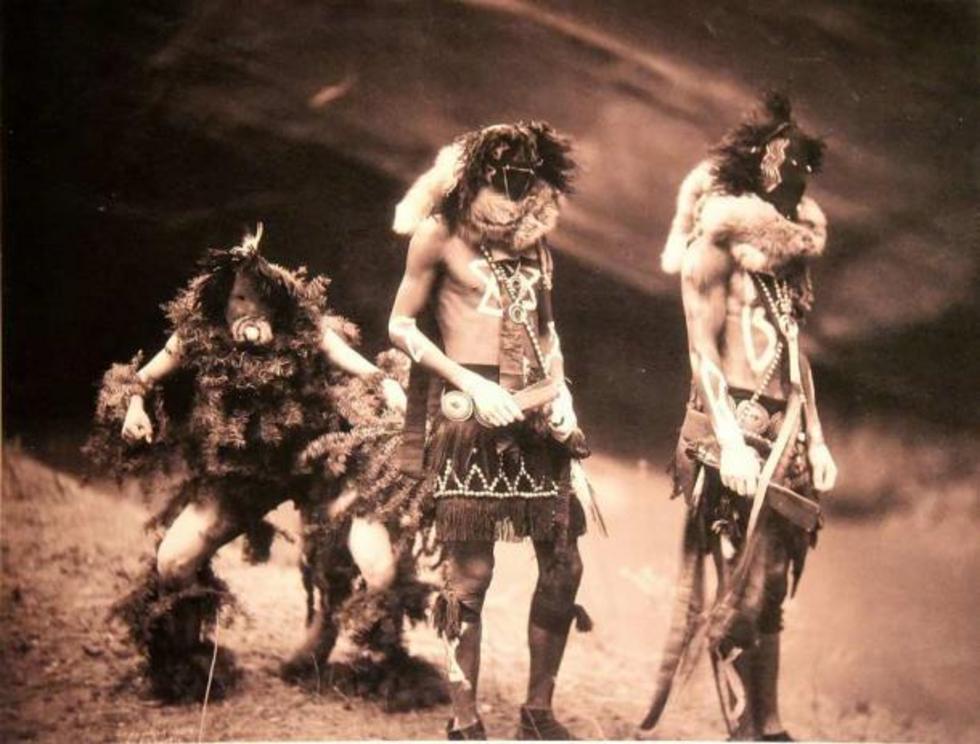 Navajo Yebichai dancers by Edward S. Curtis, 1900, signifying the arrival of the Navajo fourth world and human beings.