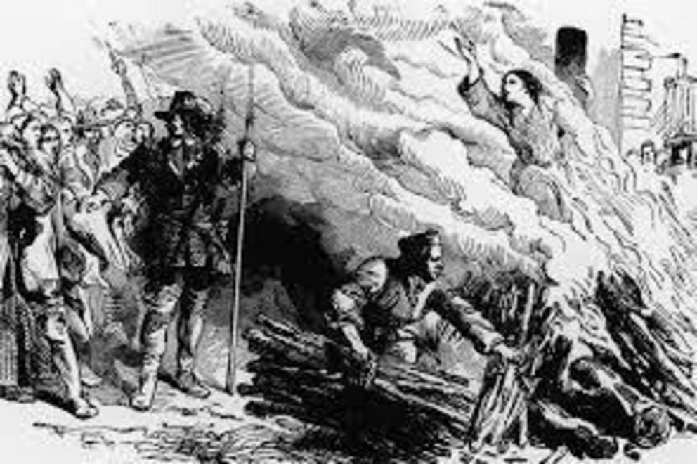 An illustration of a woman convicted of witchcraft being burned at the stake circa 1692