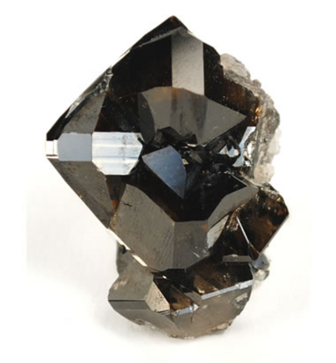 Cassiterite crystals: A cluster of cassiterite crystals from Yunnan Province, China. These crystals show the potential luster of cassiterite.