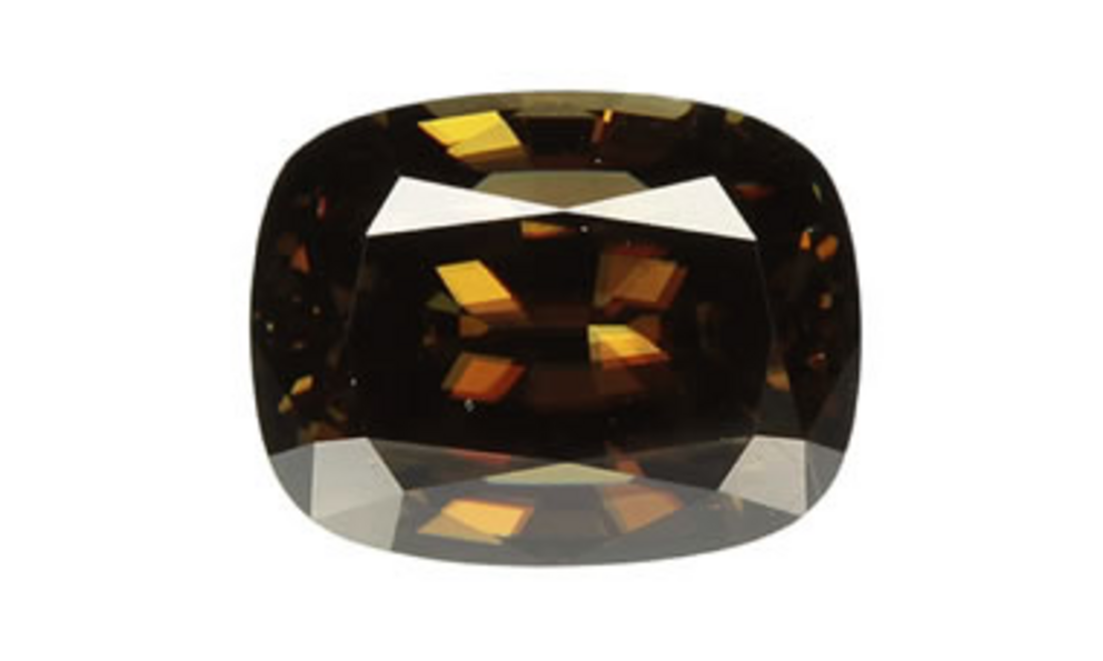 Cassiterite gem: Cassiterite is extremely rare as a transparent, gem-quality mineral. This 9 x 11 step cushion cut gem has a rich brown color and adamantine luster.