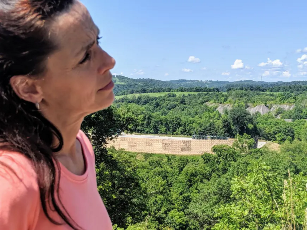 Lois Bower-Bjornson stands in front of an under-construction fracking well pad in Washington County, Pennsylvania.