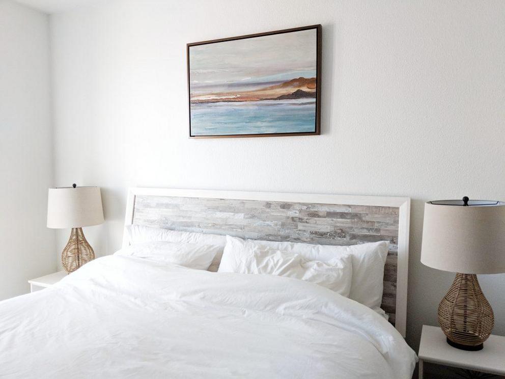 A solid headboard adds protection and creates a sense of calm and groundedness in your bedroom.