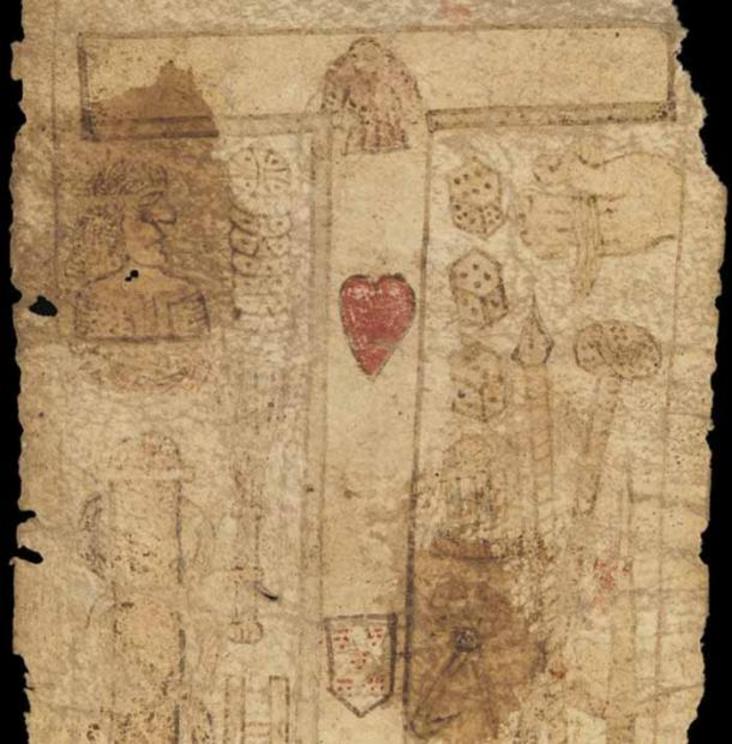 MS. 632 birthing girdle section showing a cross with a red heart and shield.