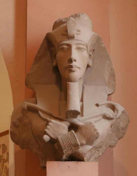 Broken colossal statue of Akhenaten in the Amarna art style.