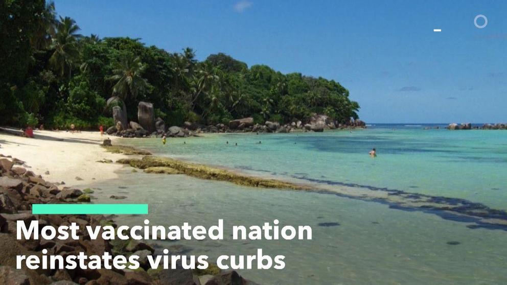 The Anse Marron beach in La Digue, Seychelles. (Photo: The Seychelles Islands/Twitter)  Read more at: https://www.bloombergquint.com/politics/world-s-most-vaccinated-nation-reintroduces-curbs-as-cases-surge Copyright © BloombergQuint