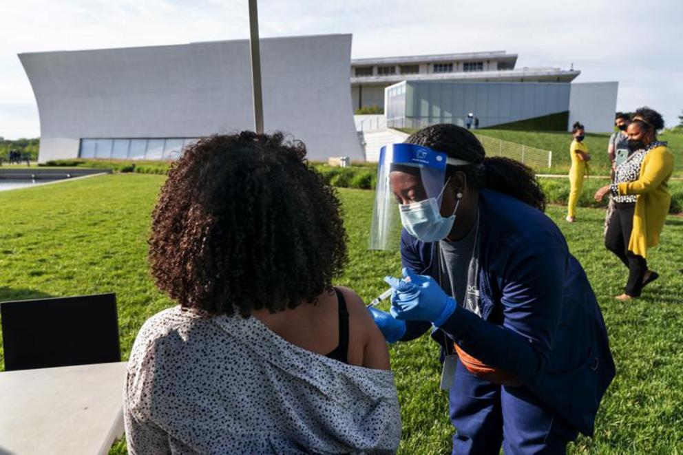 FILE - In this May 6, 2021, file photo, Kendria Brown, a nurse with DC health, vaccinates a woman with the Johnson & Johnson COVID-19 vaccine at The REACH at the Kennedy Center in Washington. From South Carolina to Washington, states are requesting the Bi