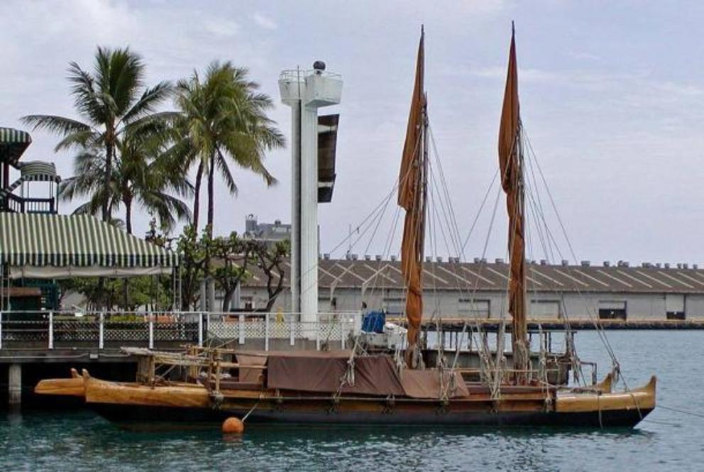 Photo of the Polynesian canoe replica Hawai'iloa, named after an early Hawaiian chief, in Honolulu harbor.
