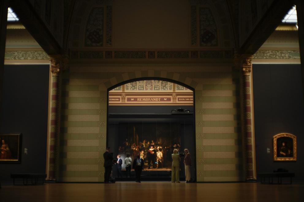 A photograph with lines showing the added parts explains how Rembrandt's biggest painting the Night Watch just got bigger with the help of artificial intelligence in Amsterdam, Netherlands, Wednesday, June 23, 2021. The Dutch national museum and art galle