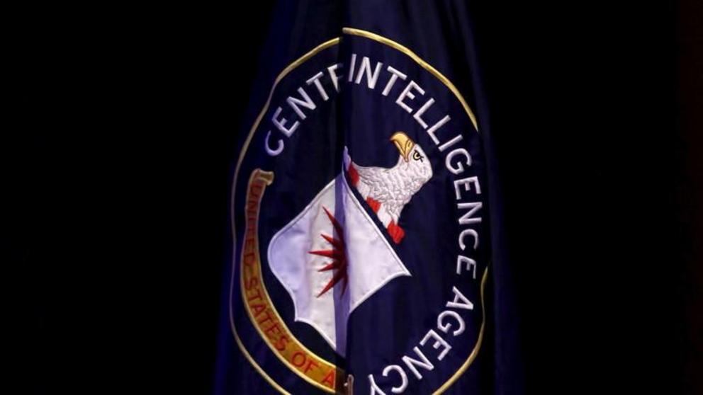 The Central Intelligence Agency (CIA) flag is displayed on stage during a conference on national security entitled 