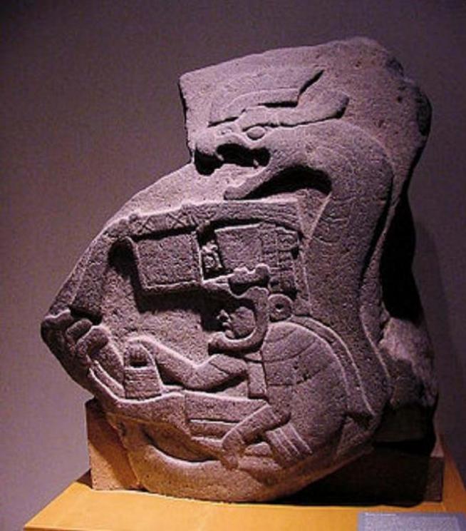 Androgynous demi-god Quetzalcoatl, offspring of the Androgynous Ometeotl carries man bag at the Olmec site of La Venta 1800 BC.