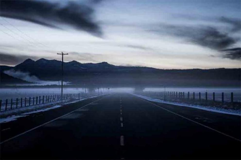 A dark foggy road at Crater Lake in Crater Lake National Park in Oregon suggests that there is light (the sacred) and darkness (unexplained phenomena) at this ancient and disturbingly mysterious location.